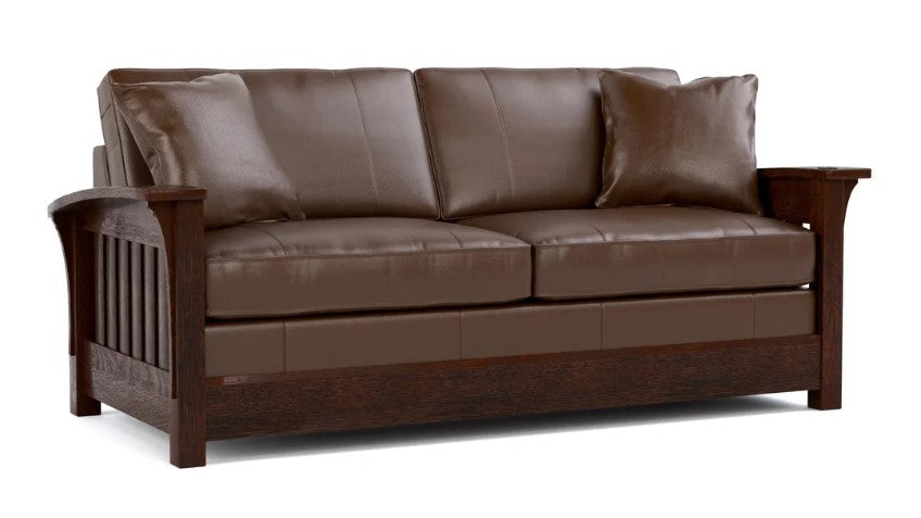 A brown leather loveseat sofa with a dark wood frame, featuring three back cushions, two throw pillows, and a slatted armrest design, shown on a white background.