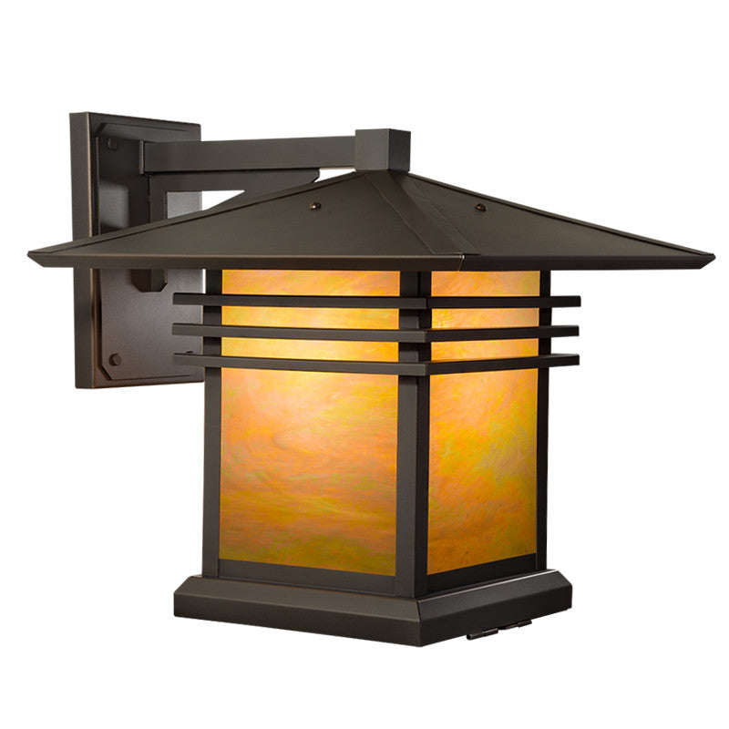 Decorative outdoor wall light with a brown metal frame and orange glass on a white background