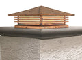 Wooden roof vent on a concrete surface with a white background