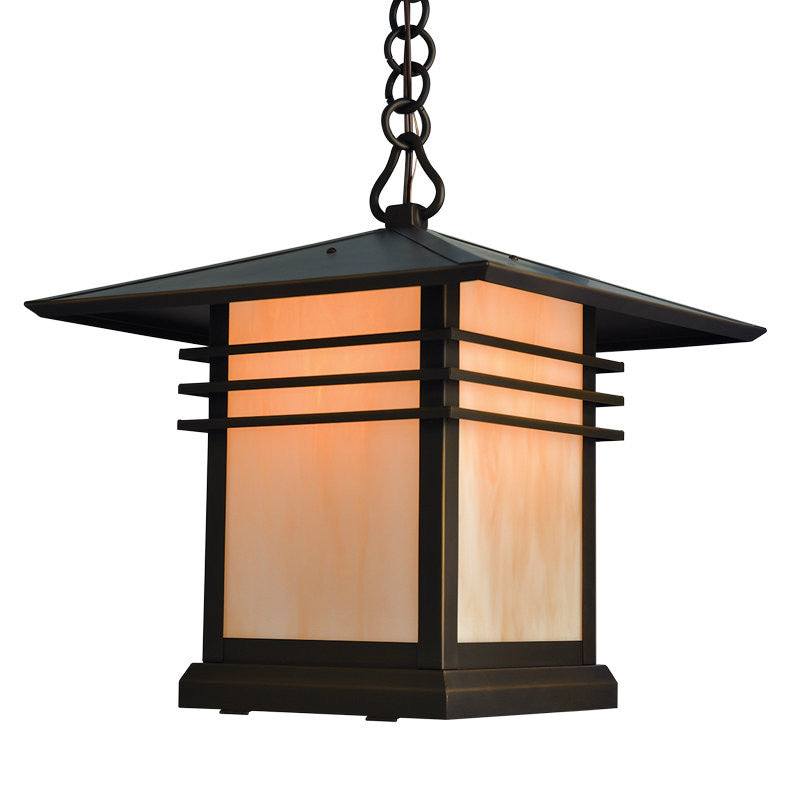 Decorative outdoor light fixture with a black frame and glass cover on a white background