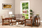 Living room with wooden furniture, including chairs, a table, and a sofa, with a window showing greenery outside.