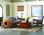 Living room with wooden furniture, a sofa, and decorative elements. Includes the Roycroft Table by Stickley. 