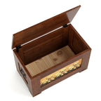 Wooden storage box with a decorative panel on a white background