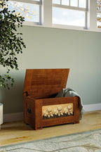 Wooden storage chest with floral design on a wooden floor near a window.