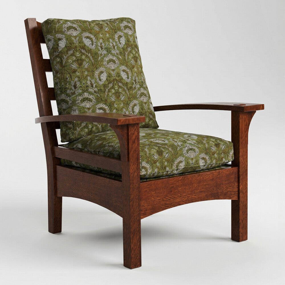 Wooden armchair with green patterned cushions on a white background
