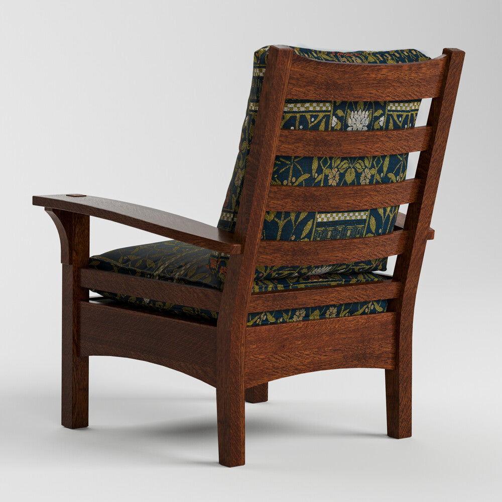 Wooden armchair with patterned cushion on a white background