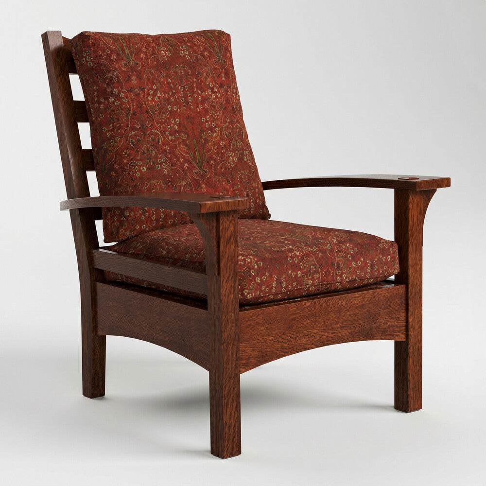 Wooden armchair with red patterned cushions on a white background
