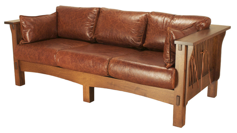 Brown leather sofa with wooden frame on a white background