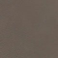 A close-up of a textured material swatch in a warm taupe-brown color, showing a fine pebbled grain pattern.