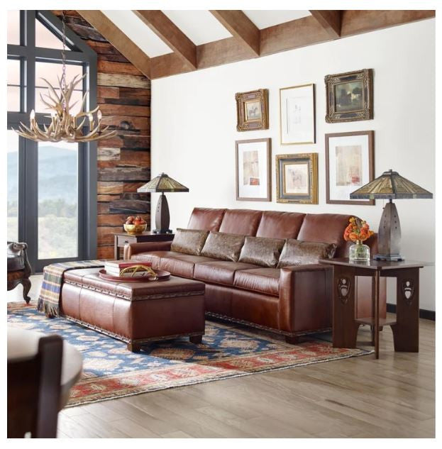 Living room with brown leather sectional sofa, wooden coffee table, decorative elements, and the Stickley Argyle Street End table. 