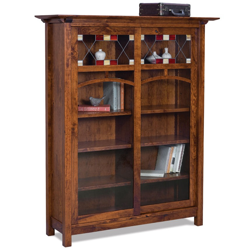 A rustic brown wooden bookcase with two glass-paneled doors, open shelves, and decorative items displayed on and inside, shown against a plain white background.