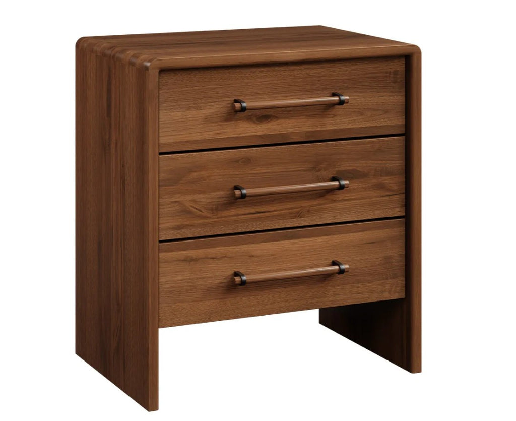 A three-drawer wooden nightstand with a warm medium-brown finish and dark metal drawer pulls, shown on a plain white background.