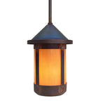 Pendant light with orange glass shade on a white background