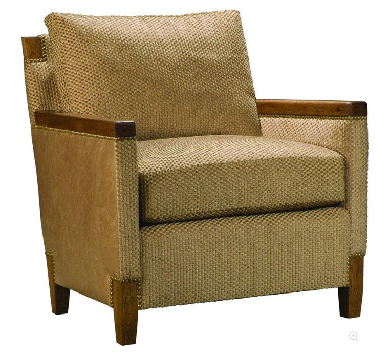 Beige armchair with wooden armrests and legs on a white background