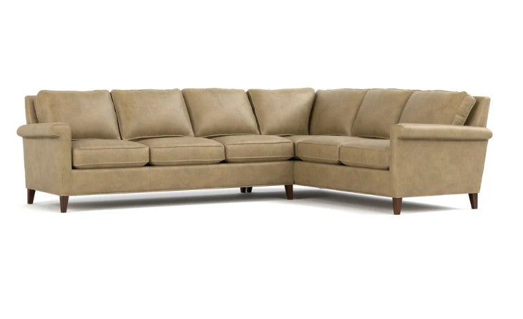 A beige sectional sofa with a right-facing L-shape, upholstered in a textured fabric, featuring dark wood legs, shown against a plain white background.