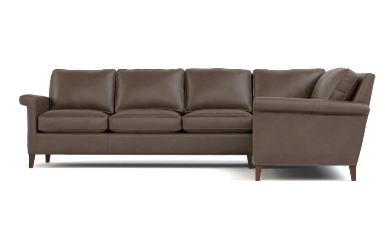 A three-seater sofa with a right-side chaise lounge in brown leather, shown from a front-facing perspective against a plain white background.