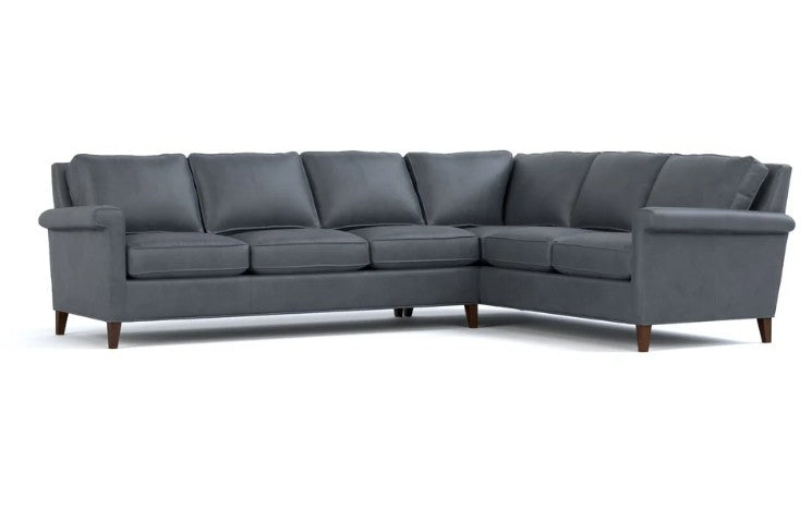 A modern gray upholstered sectional sofa with a right-facing L-shape, featuring dark brown wooden legs, shown against a plain white background.