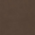 A close-up of a brown textured material, resembling pebbled leather or vinyl, filling the entire frame.