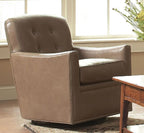 Brown leather armchair in a room with a wooden table and window.