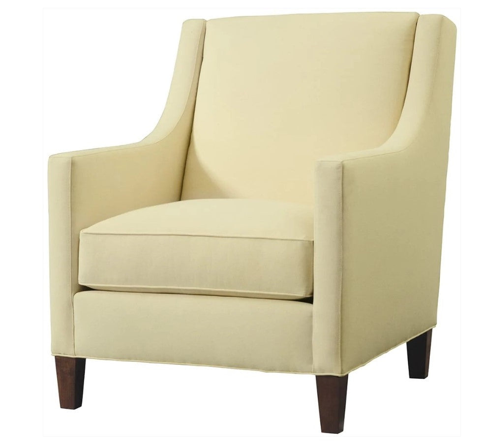 Beige armchair with wooden legs on a white background