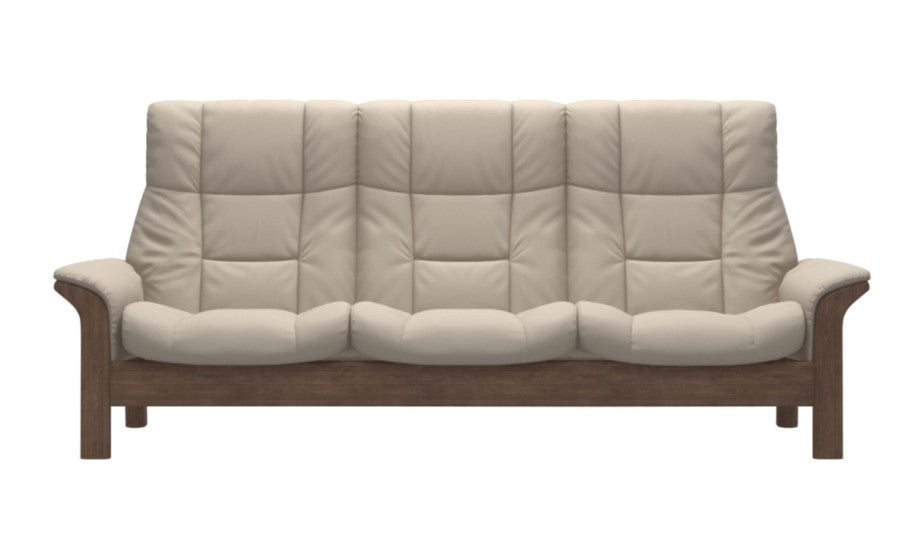 A three-seater sofa with thick, tufted cream-colored cushions and a medium brown wooden frame, shown against a plain white background.