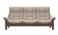 A three-seater sofa with thick, tufted cream-colored cushions and a medium brown wooden frame, shown against a plain white background.