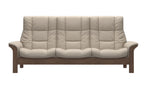 A three-seater sofa with thick, tufted cream-colored cushions and a medium brown wooden frame, shown against a plain white background.