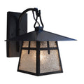 Black outdoor wall light fixture with glass shade on a white background