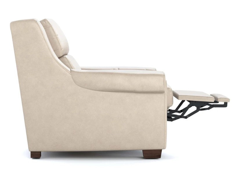 A side-profile view of a beige upholstered recliner chair with its footrest extended, set against a plain white background.