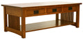 Wooden table with three drawers and a shelf on a white background