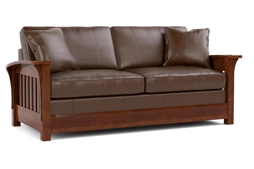 A brown leather loveseat sofa with a dark wood frame, featuring two matching throw pillows, shown against a plain white background.