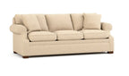 A three-seater upholstered sofa in a textured beige fabric, featuring four matching back cushions, rolled arms, and dark wooden legs, shown against a plain white background.