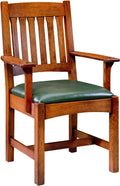 Wooden chair with green cushion on a white background