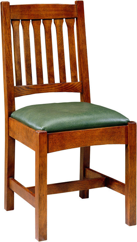 Wooden chair with a green cushion on a white background