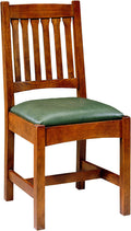 Wooden chair with a green cushion on a white background
