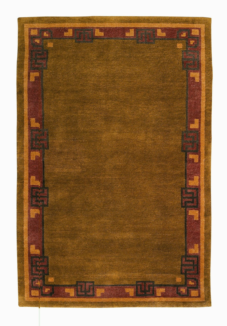 Rectangular green rug with a decorative border on a white background