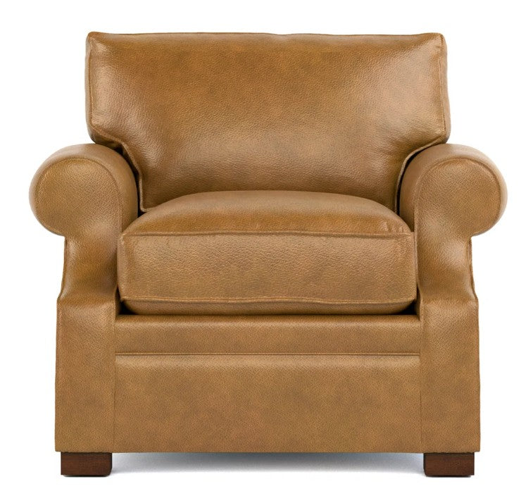 A classic brown leather armchair with rolled arms, a thick seat cushion, and dark wooden feet, shown against a plain white background.