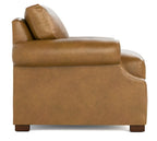 A tan leather armchair shown from a side angle against a plain white background.