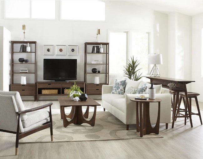 Modern living room with white sofa, armchair, and wooden coffee table.