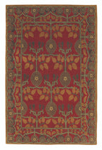 Decorative rug with intricate pattern on a red background