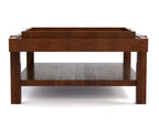A dark brown wooden coffee table with a rectangular top, open lower shelf, and blocky legs, shown against a plain white background.