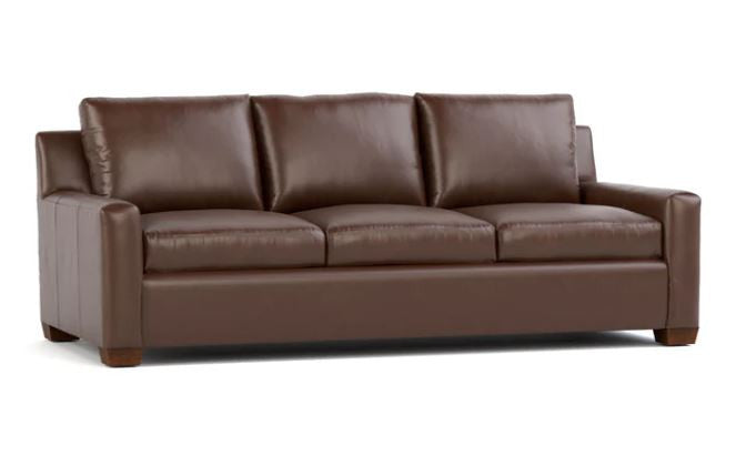 Brown leather sofa on a white background