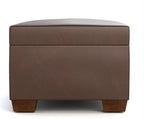 Brown storage ottoman with a white background