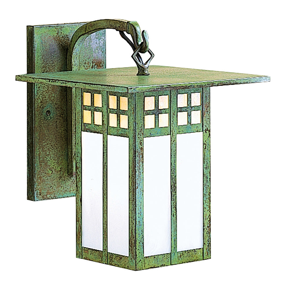 Green metal wall light fixture with glass panels on a white background