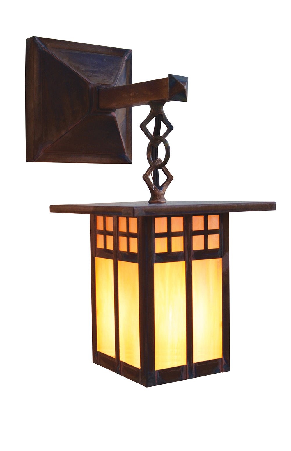 A dark brown wooden outdoor wall sconce with a glowing warm yellow-orange light, featuring a square backplate, decorative twisted central post, and a rectangular lantern shade with geometric window panels.