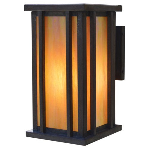 Decorative wall light with orange glass and black frame on a white background