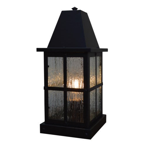 Black outdoor lantern with glass panels on a white background