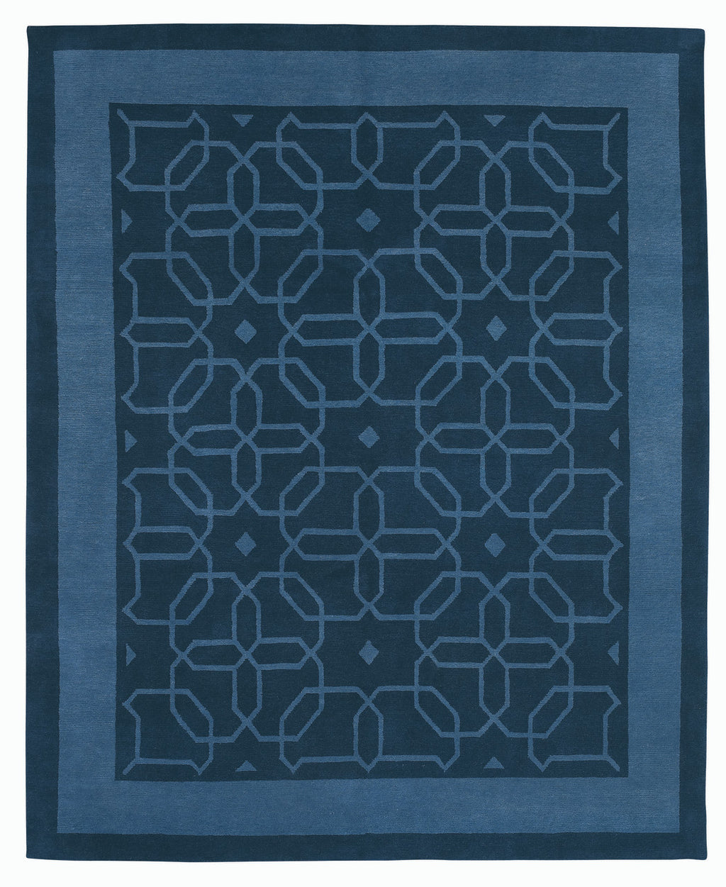 Blue geometric patterned rug on a white background