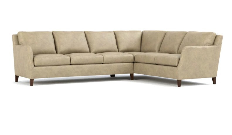 A light beige upholstered sectional sofa with a right-angle corner design, shown on a plain white background.