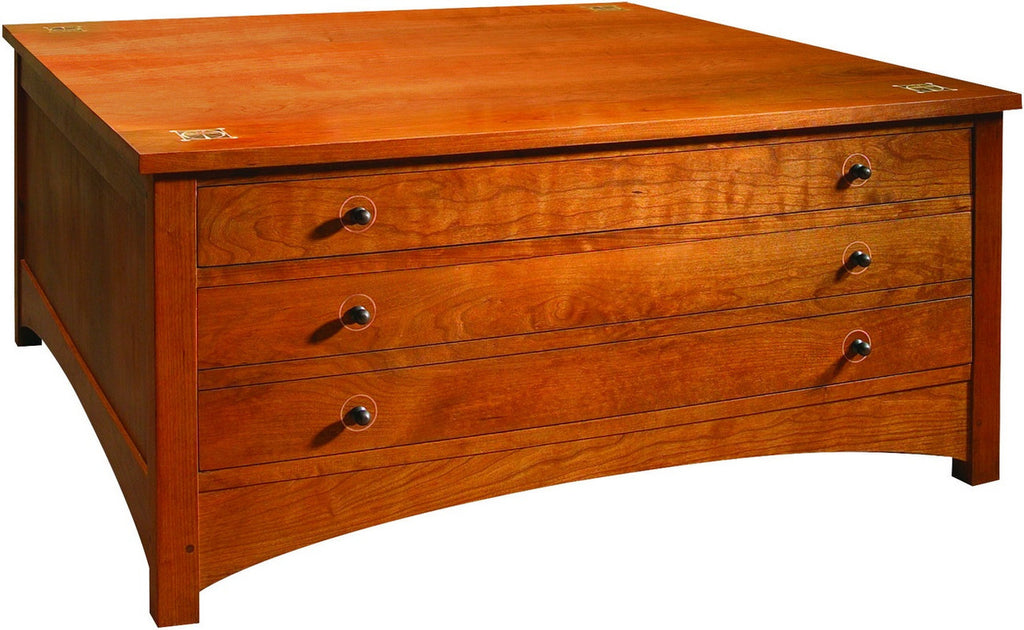 Wooden dresser with four drawers on a white background